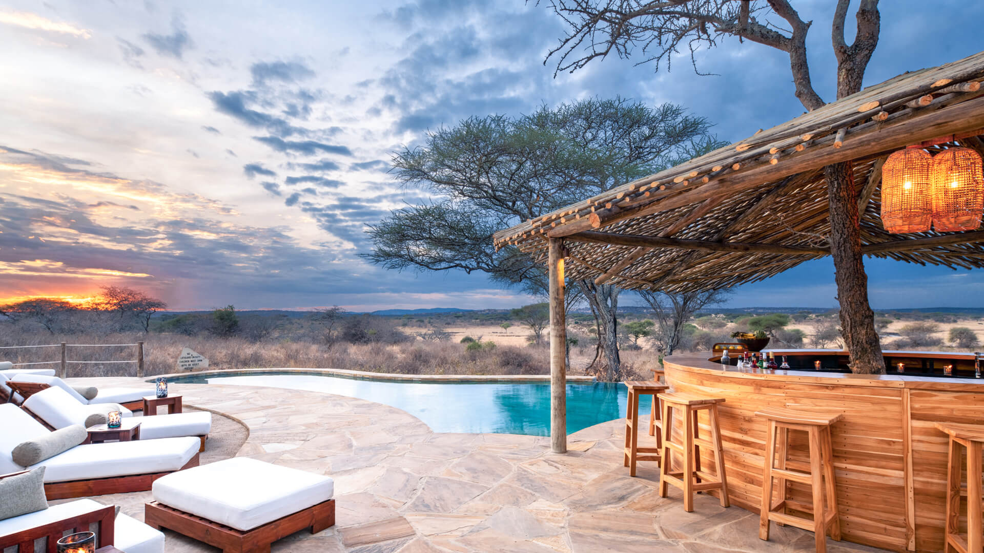 Sunset from the swimming pool cocktail bar at Oliver's Camp