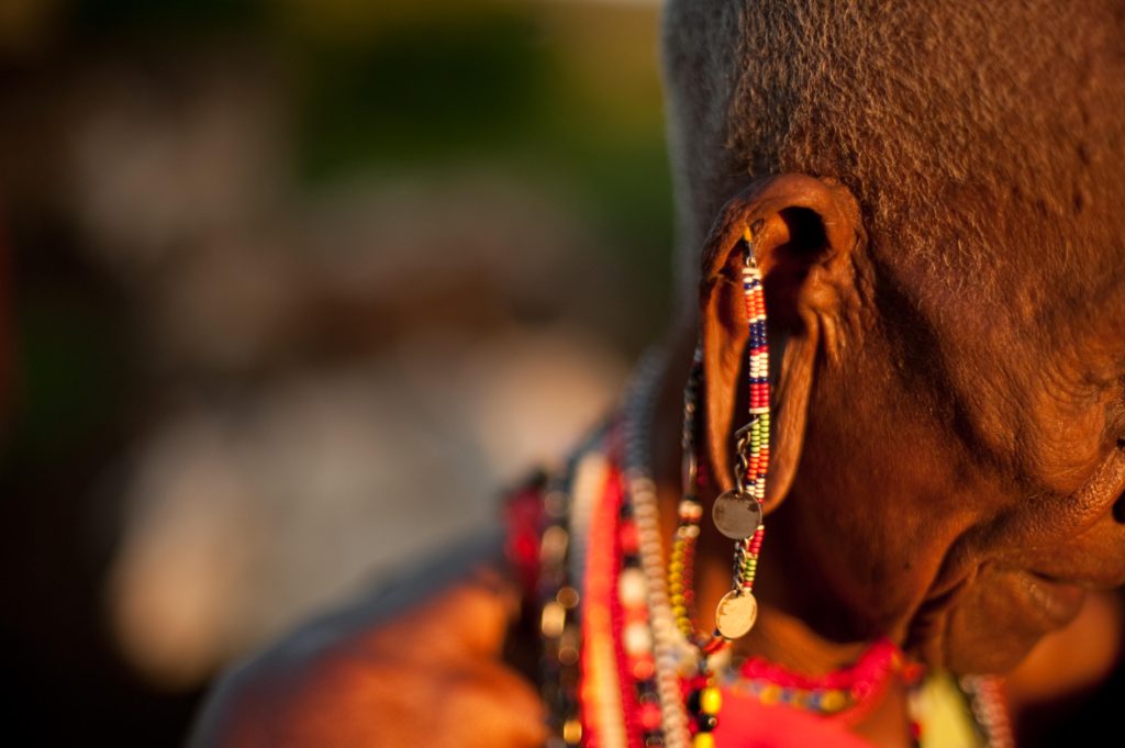 A close up of the various pieces of jewellery adorning a Maasai's ear.