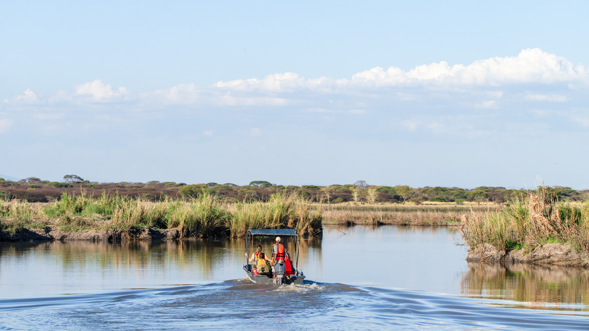 A boating safari on the waters near Usangu Camp in East Africa - Asilia Africa