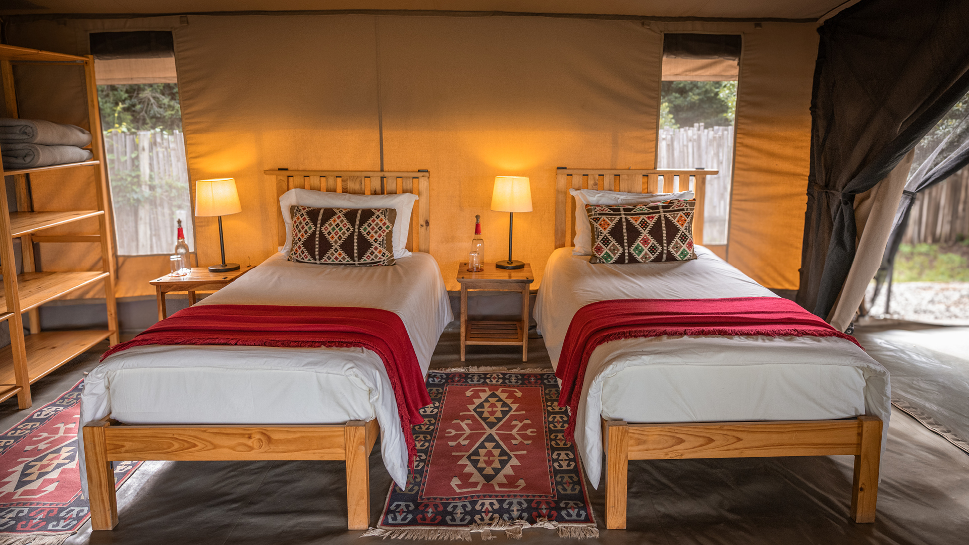 a view of one of the bedrooms in the family tent at ol pejeta bush camp in kenya, asilia africa