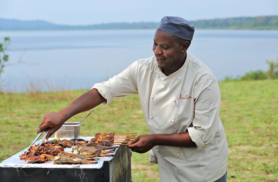 A chef prepares a tasty barbecue for a meal to be enjoyed outdoors | Asilia Africa