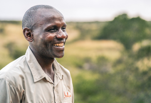 Asilia staff member smiling at Encounter Mara camp, Mara Naboisho Conservancy, Kenya, East Africa