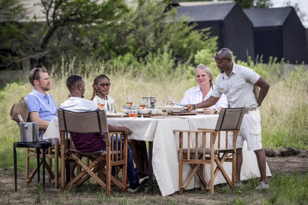 Enjoying an al-fresco lunch with colleagues in Olakira Camp.