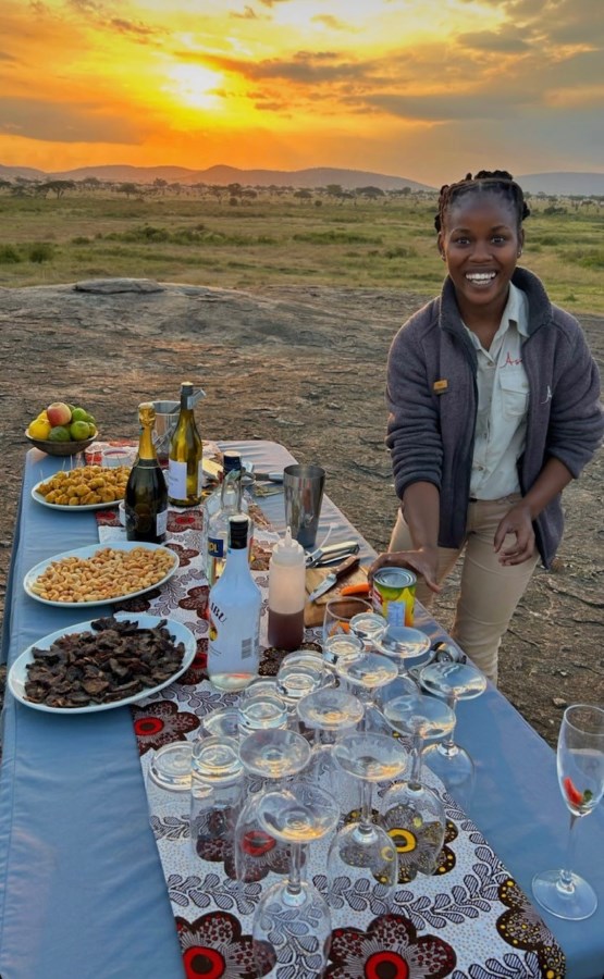Doris hosting a bush sundowner in the Serengeti.