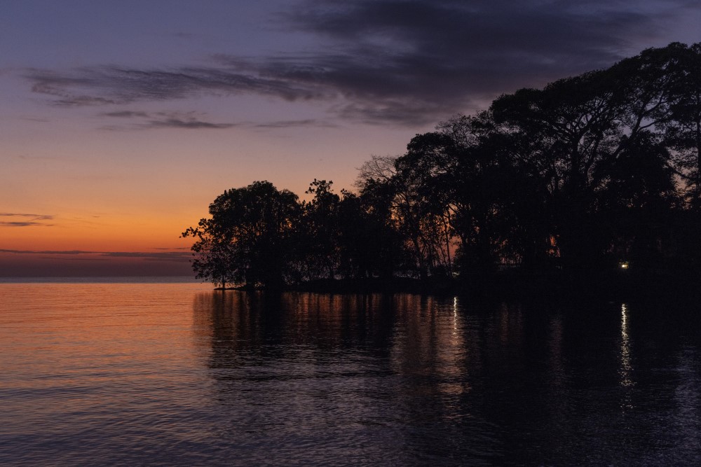 The glow of dawn, pushing it's presence into the night sky over Lake Victoria, Tanzania