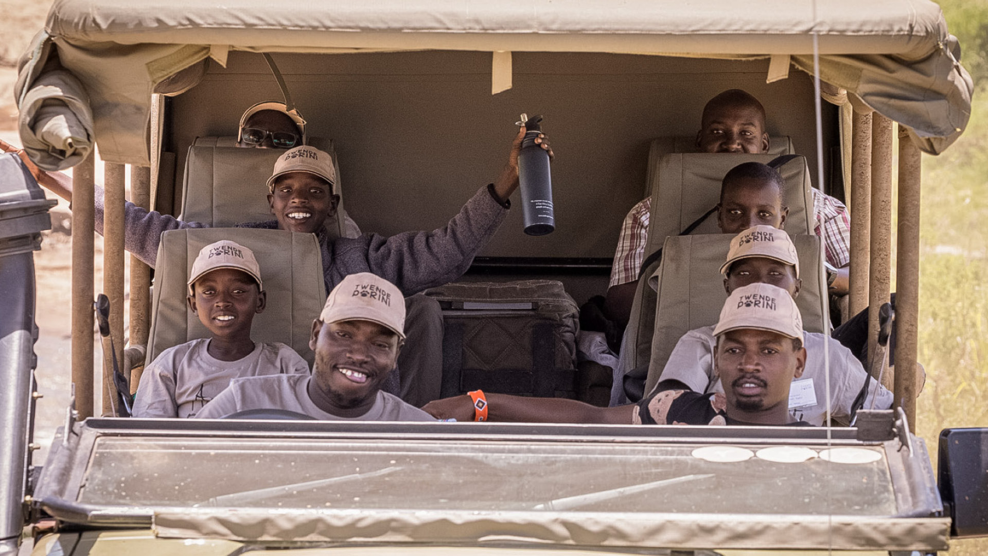 Children in a safari vehicle on an Asilia Africa Twende Porini trip at Rekero Camp in Tanzania