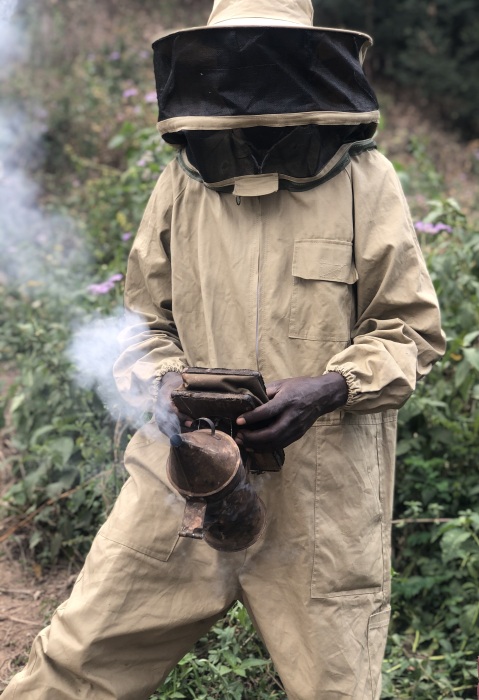Modern equipment like suits and smokers are now in use, Bwindi, Uganda.