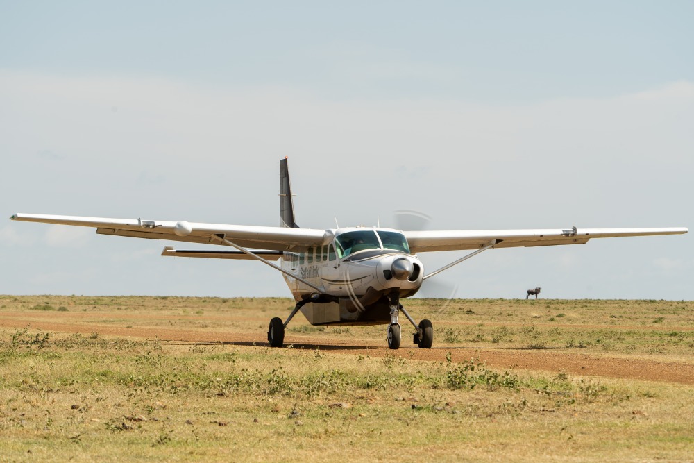 A small plane on bush runway ready for take off, Kenya.