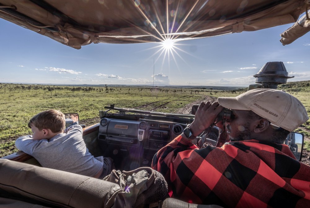 Rupert and his guide survey the landscape, Mara Naboisho Conservancy, Kenya.