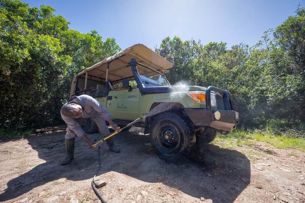 A vehicle being washed with repurposed grey-water.