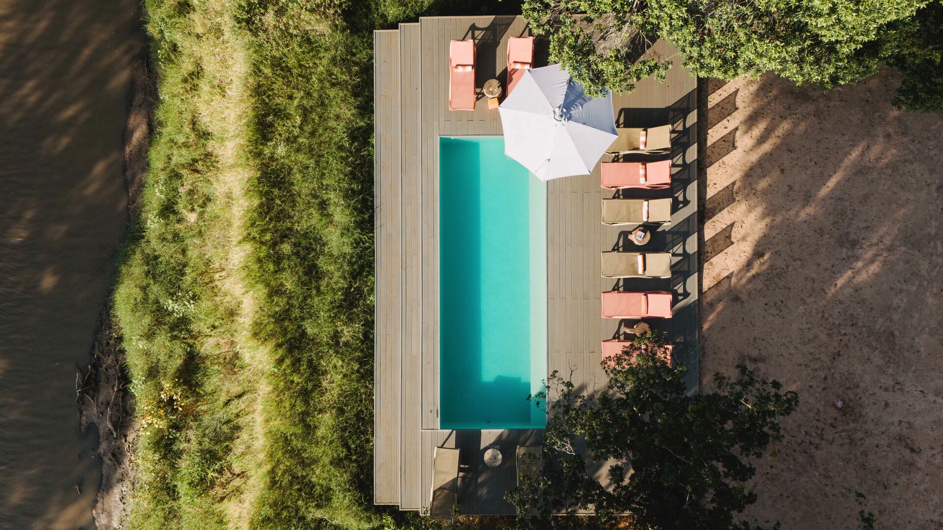 An aerial view of Emboo camp's swimming pool on the Talek river in Kenya