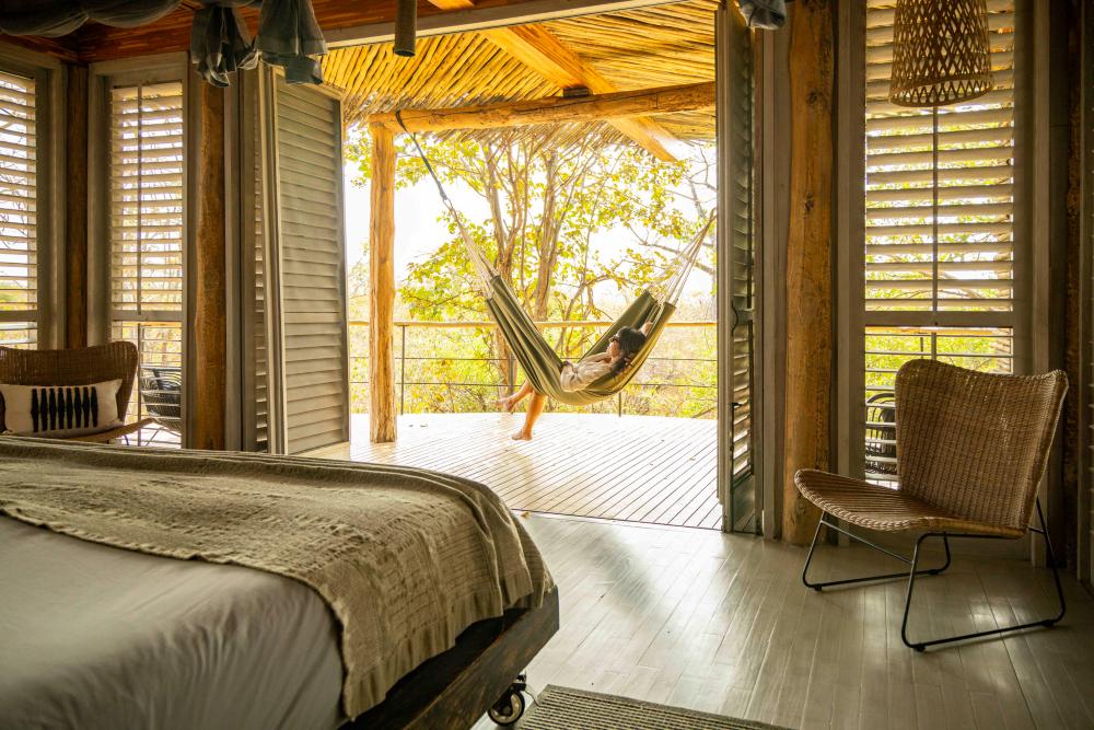 A guest relaxes in a hammock at Jabali Ridge, Ruaha National Park, Tanzania.