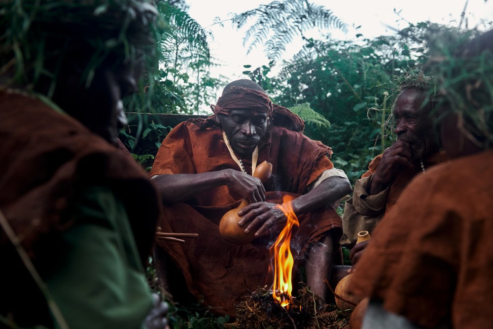 Re-enacting the post-hunt meal, Bwindi Forest, Uganda
