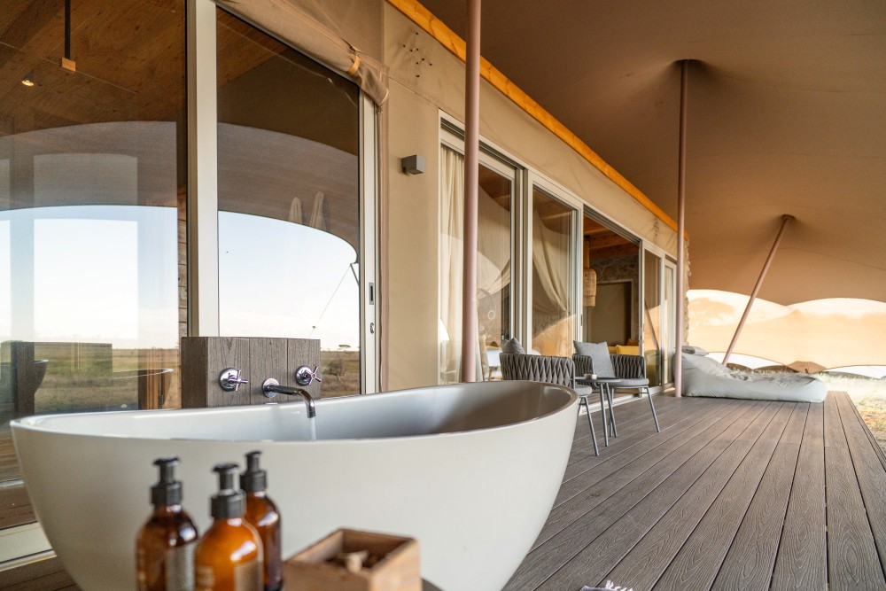 Private veranda and outdoor bath at Namiri Plains, Tanzania.