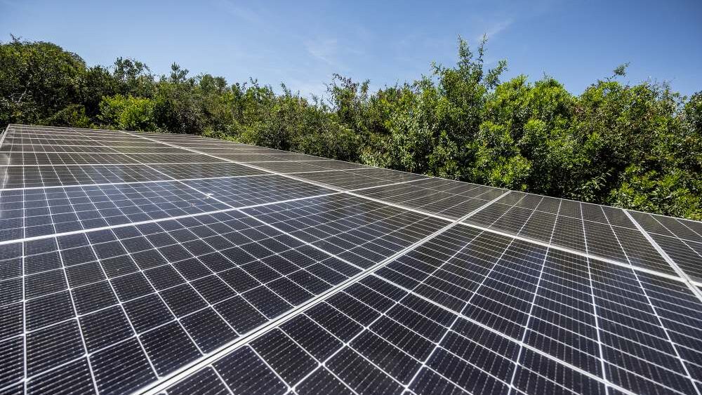 A bank of solar panels generating power for a camp, Kenya.